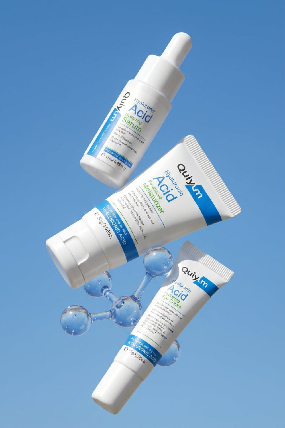Cosmetic bottles with blue labels against a clear blue sky